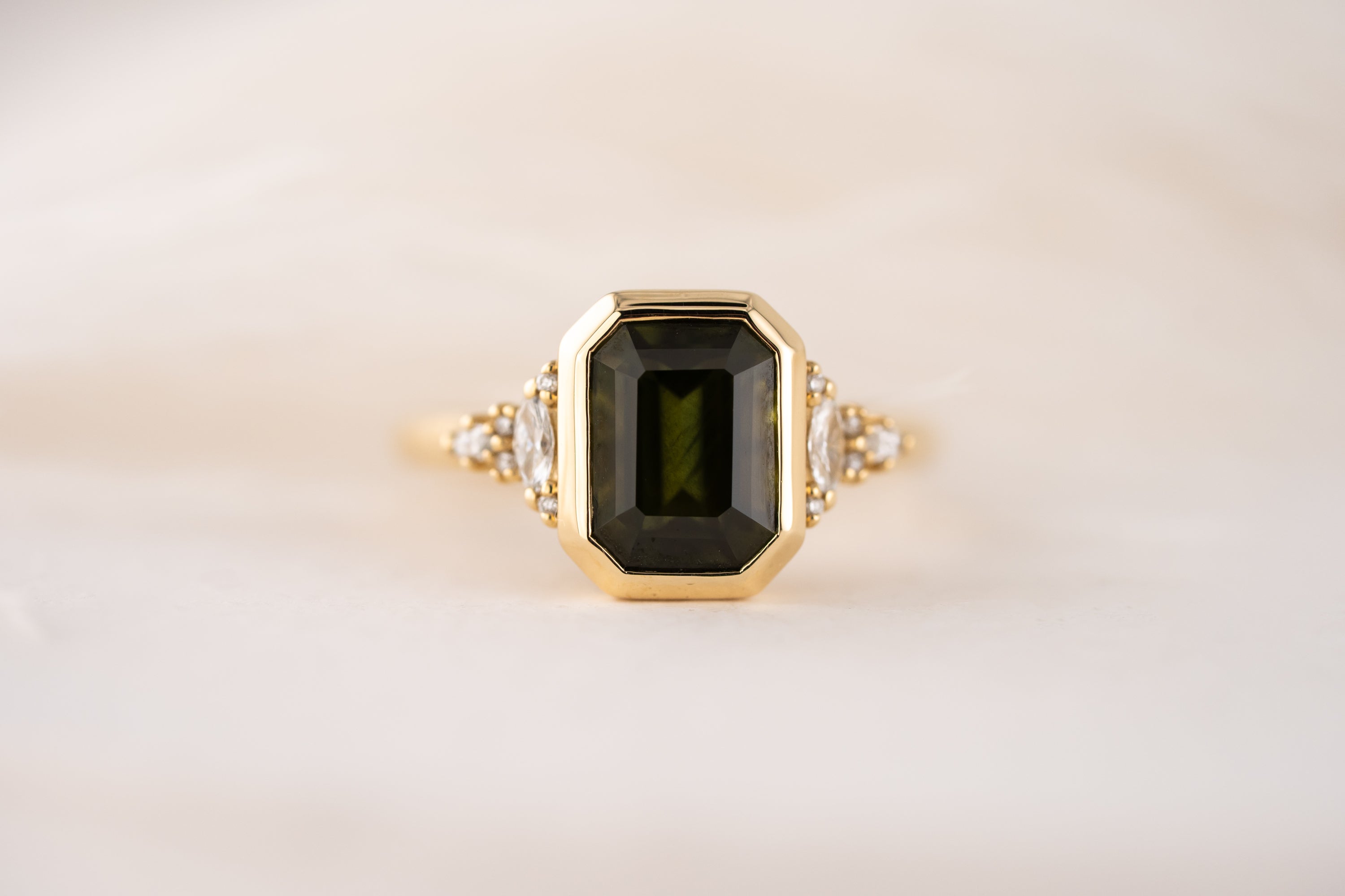 The Bezel Maeve Ring | 3.55 CT Emerald Cut Green Sapphire