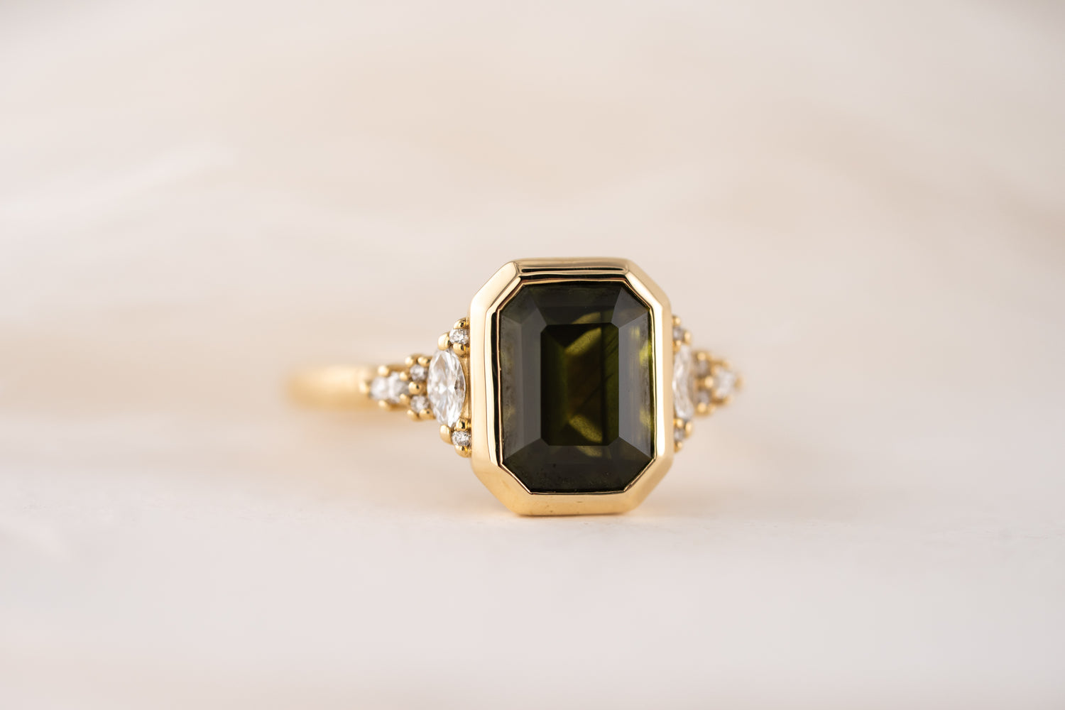 The Bezel Maeve Ring | 3.55 CT Emerald Cut Green Sapphire
