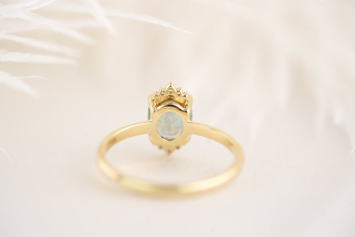 The Half Halo Ring - 1.54 CT Oval Minty Teal Montana Sapphire