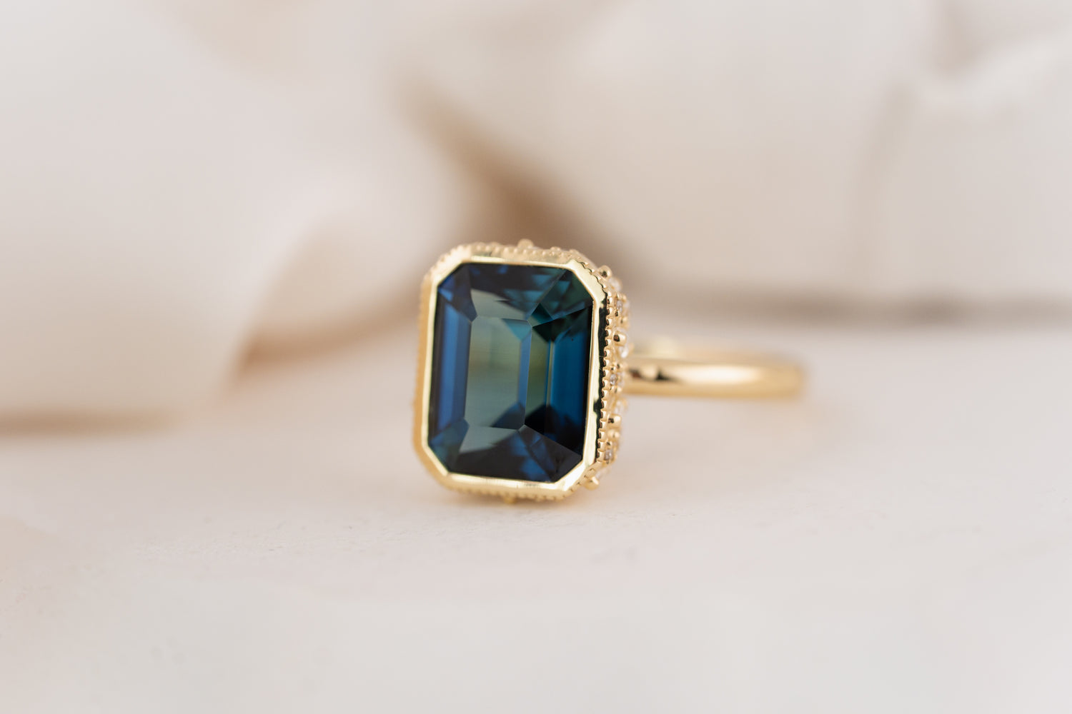 The Sitara Ring | 5.53 CT Emerald Cut Teal Sapphire - Lavender Creek Gems