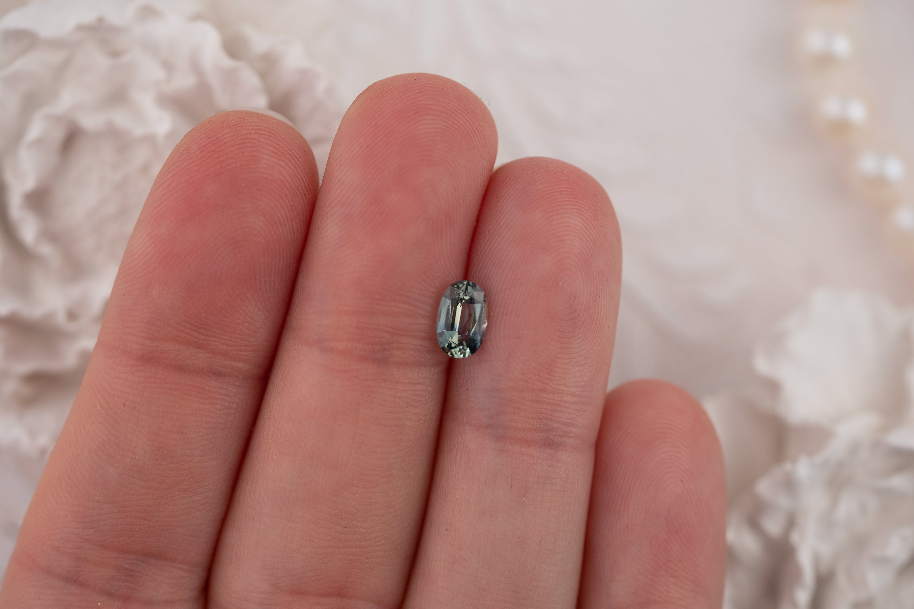 0.94 CT Oval Bicolor Teal Sapphire - Lavender Creek Gems 