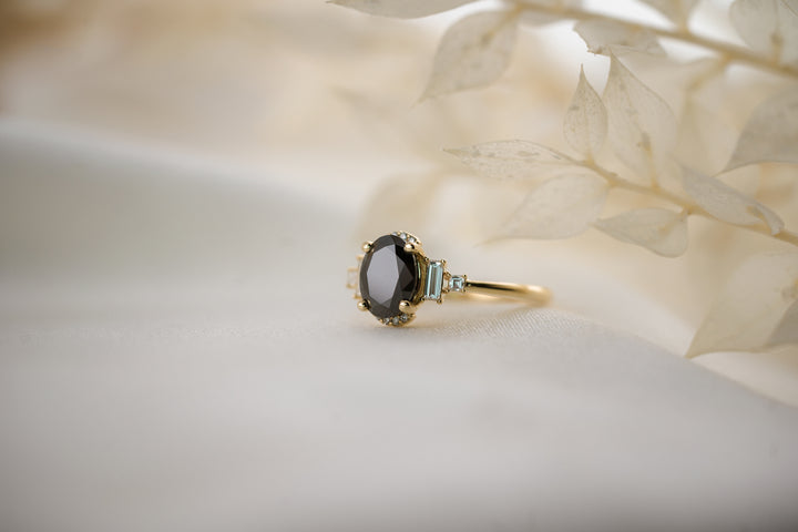 The Sura 1.5 CT Oval Black Moissanite Ring
