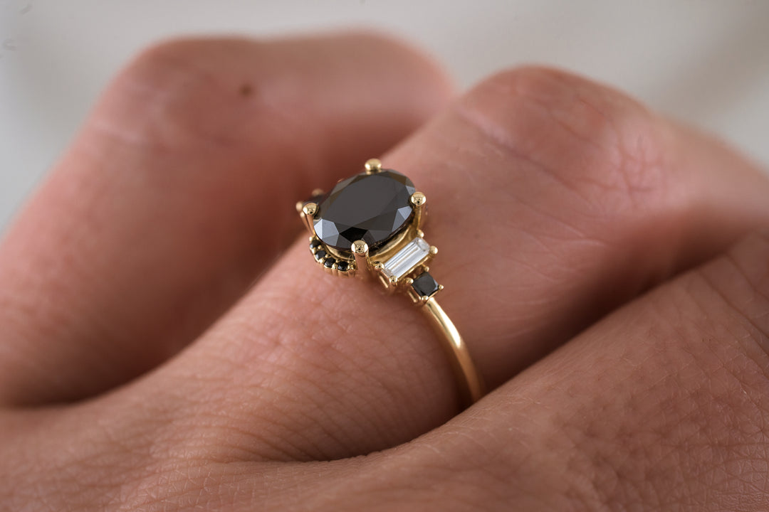 The Sura 1.5 CT Oval Black Moissanite Ring - Black Diamond Accents