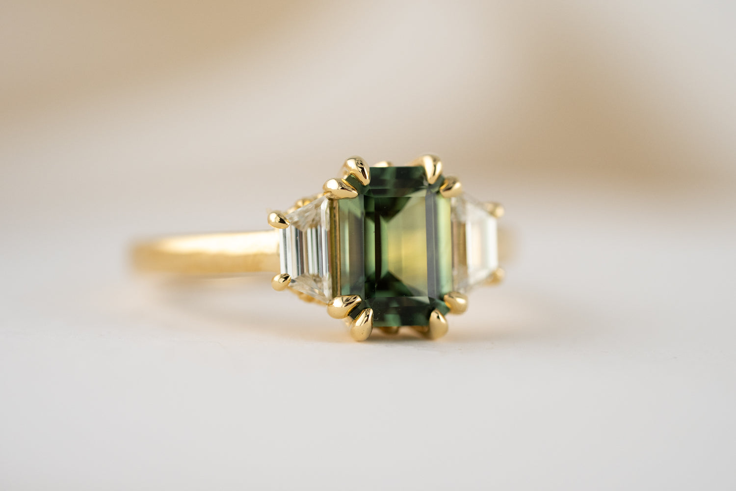 The Tría Ring | 1.85 CT Emerald Cut Teal Green Sapphire