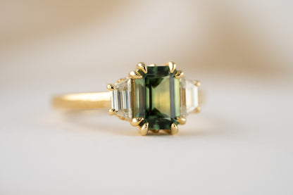 The Tría Ring | 1.85 CT Emerald Cut Teal Green Sapphire