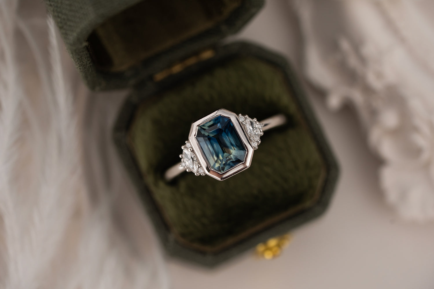 The Low Bezel Maren Ring | 2.22 CT Emerald Cut Bicolor Blue Sapphire