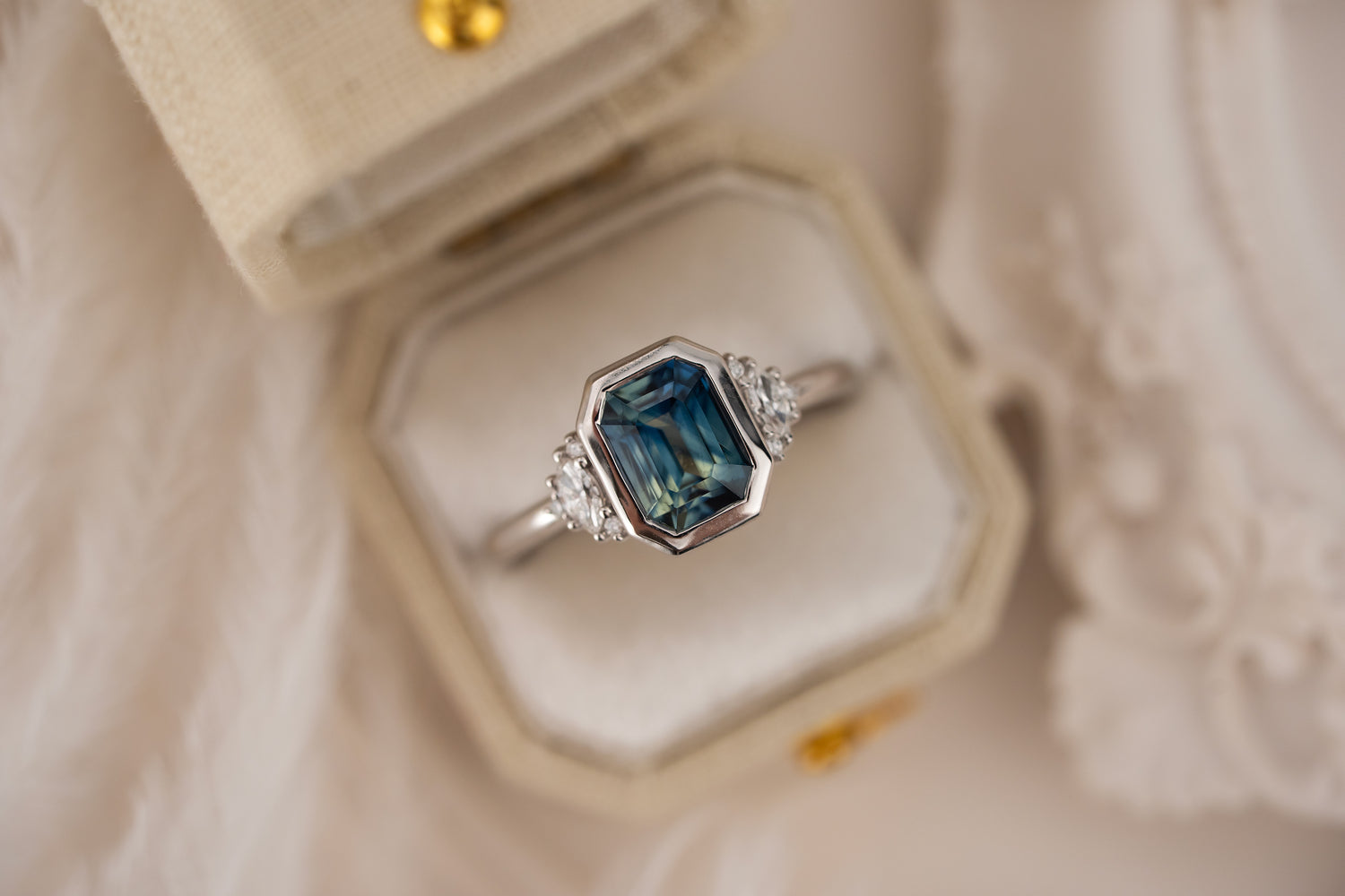 The Low Bezel Maren Ring | 2.22 CT Emerald Cut Bicolor Blue Sapphire
