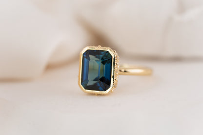 The Sitara Ring | 5.53 CT Emerald Cut Teal Sapphire